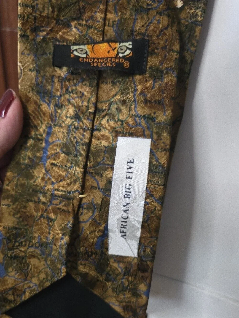 African Big 5 themed silk tie featuring an animal print pattern.